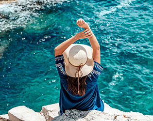 Woman relaxing by the sea